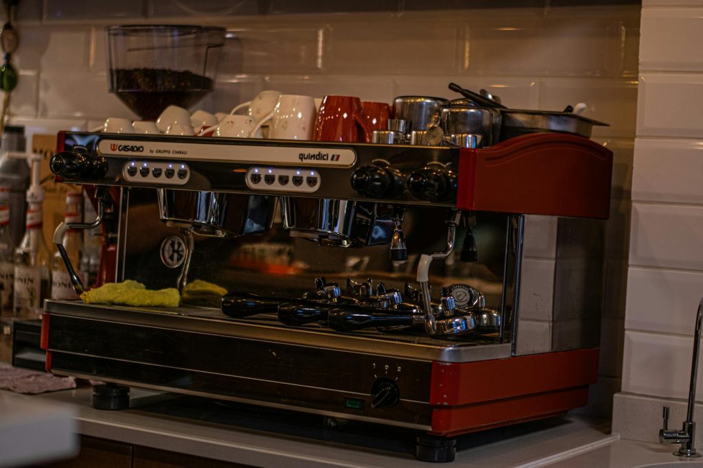 Barista using an espresso machine showing key coffee machine features