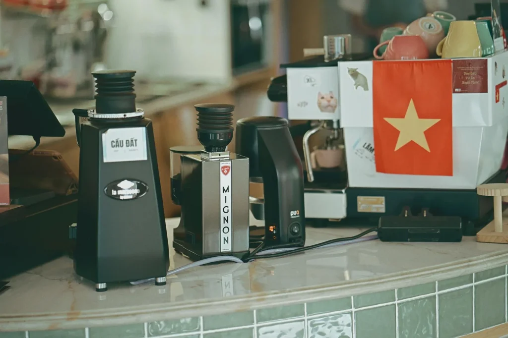 Coffee grinder with fresh beans on a kitchen counter