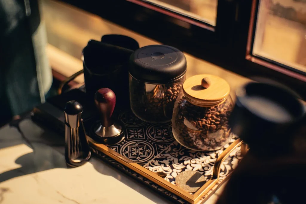 Airtight coffee storage canister with fresh coffee beans on kitchen counter