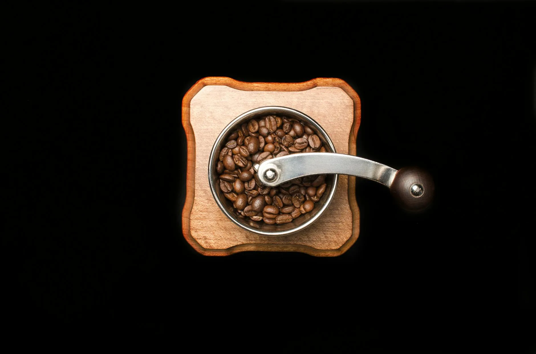 Coffee grinder with espresso beans ready for grinding at home