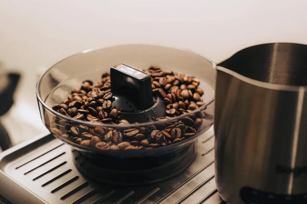 Coffee grinder with fresh beans ready for grinding