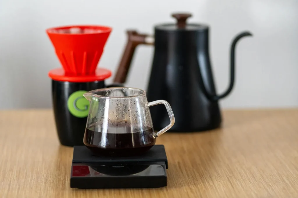 Pour-over coffee brewing on a digital scale with a gooseneck kettle