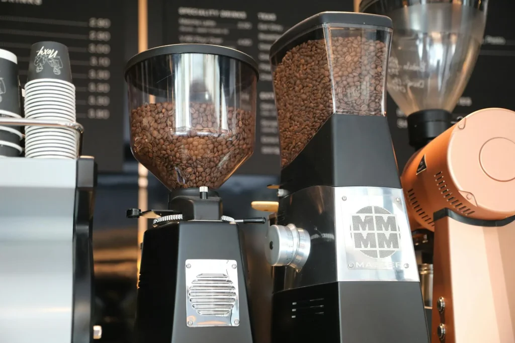 Espresso grinder with fresh coffee beans ready for single dose grinding