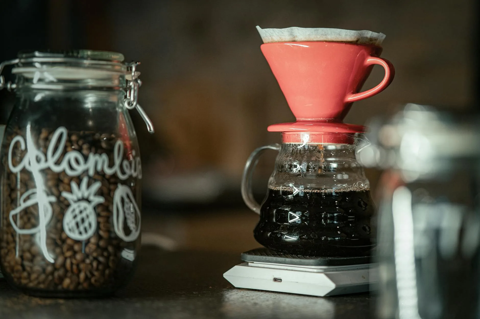 Coffee grinder with beans on kitchen counter