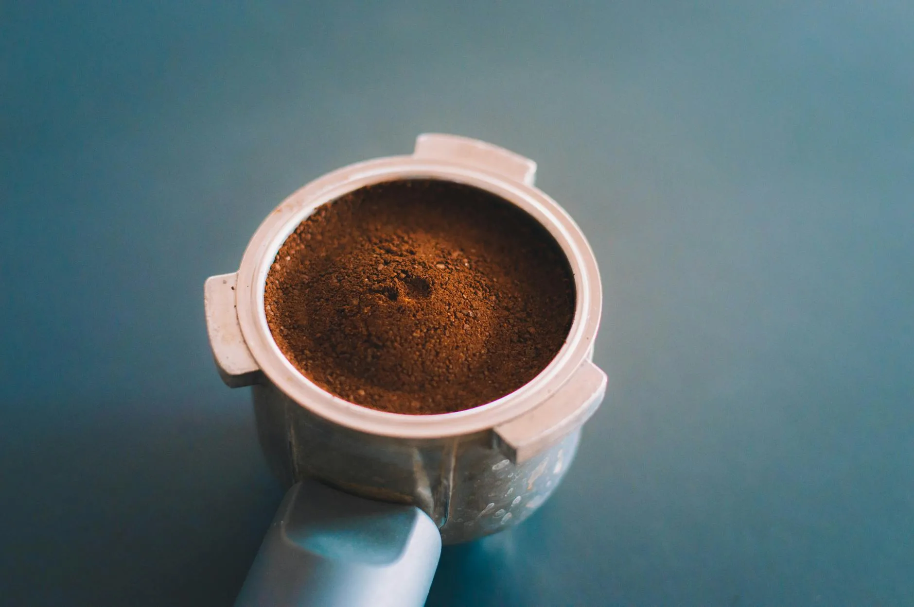 Fresh coffee grounds in an espresso portafilter