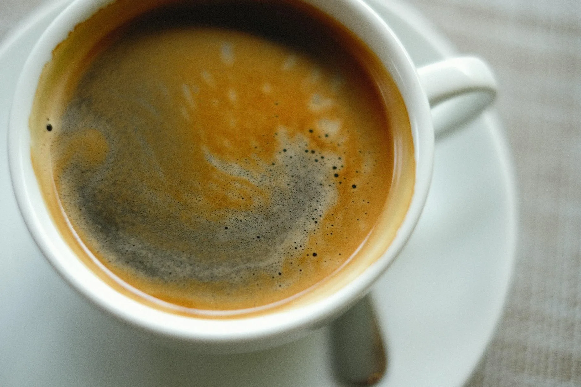 Espresso with rich crema in a cup close up