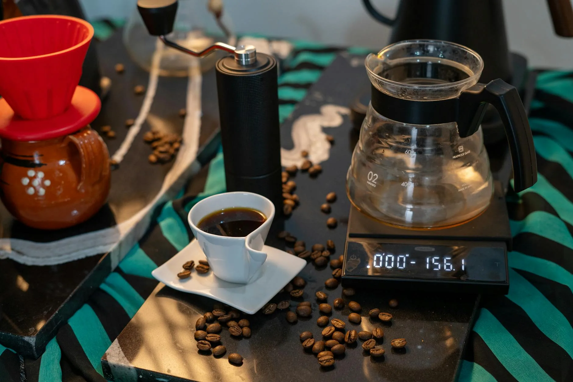 Manual hand coffee grinder on a brewing setup