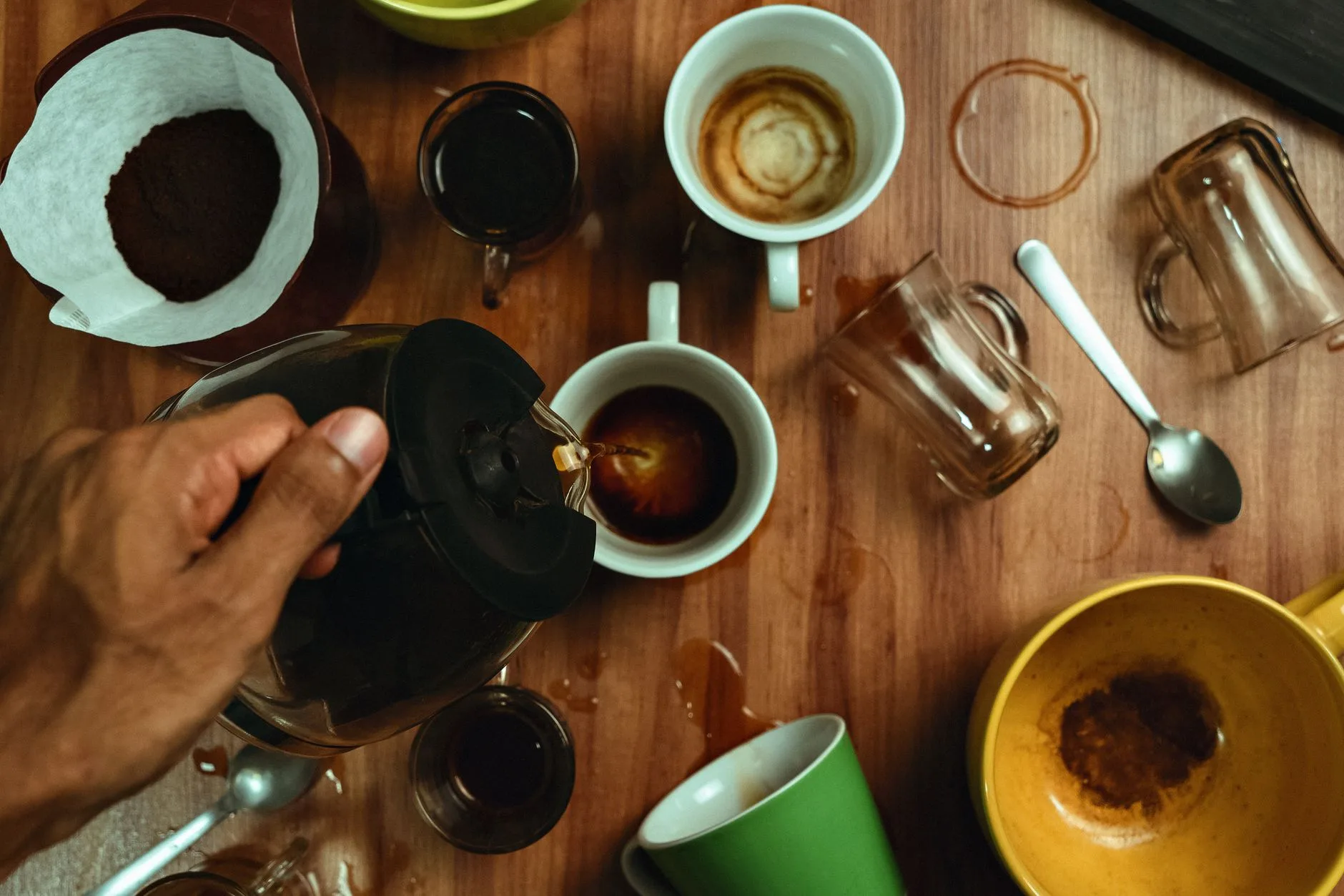 Coffee cupping cups and beans on a tasting table
