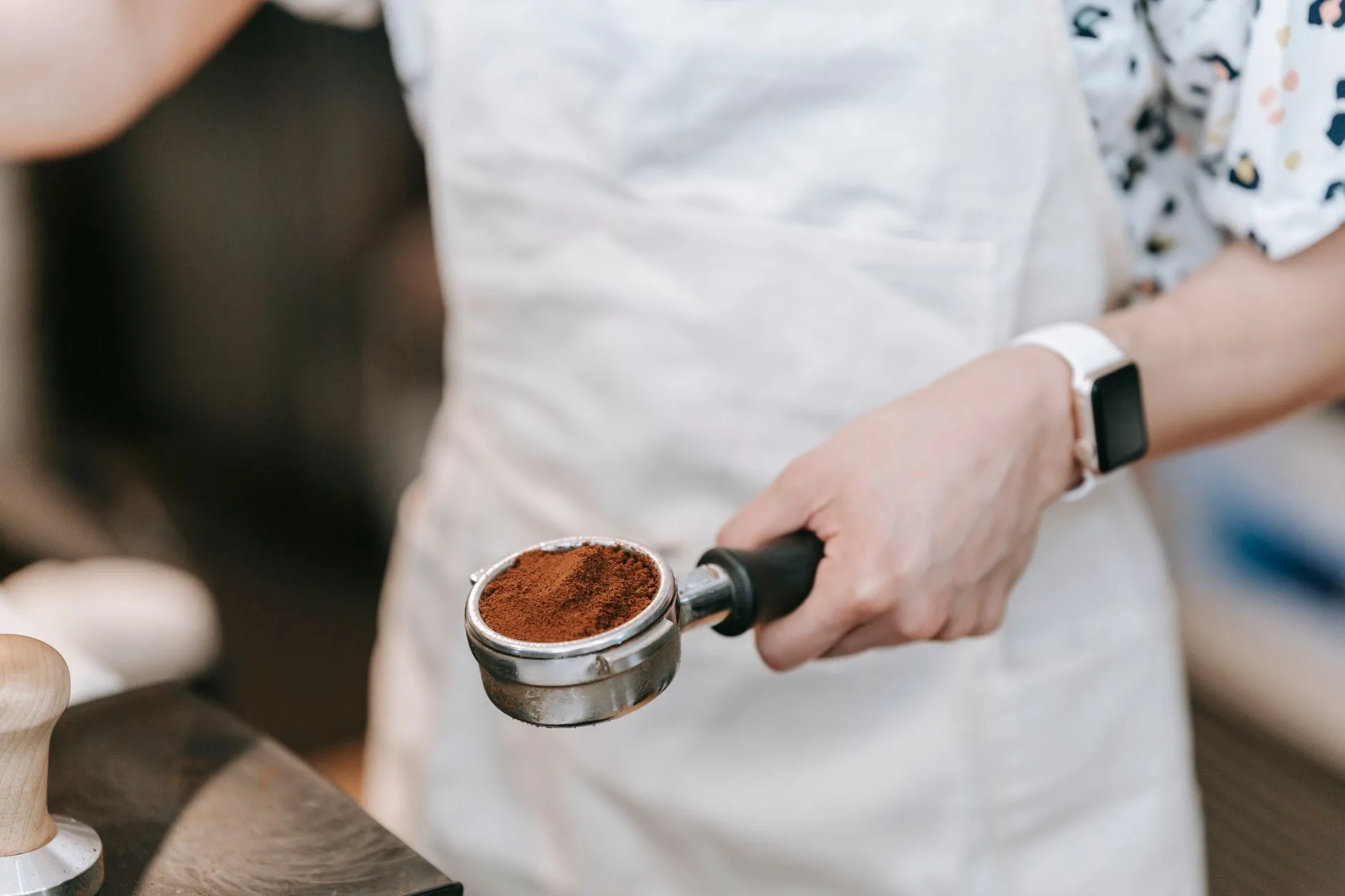 Ground coffee in an espresso portafilter basket