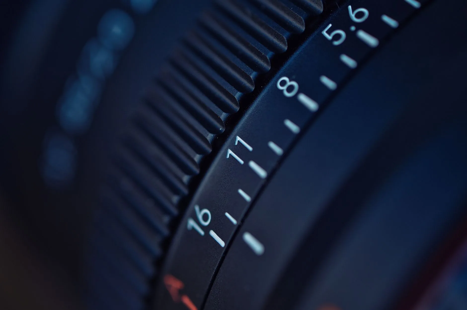 Close-up of an espresso grinder dial for tiny grind adjustments