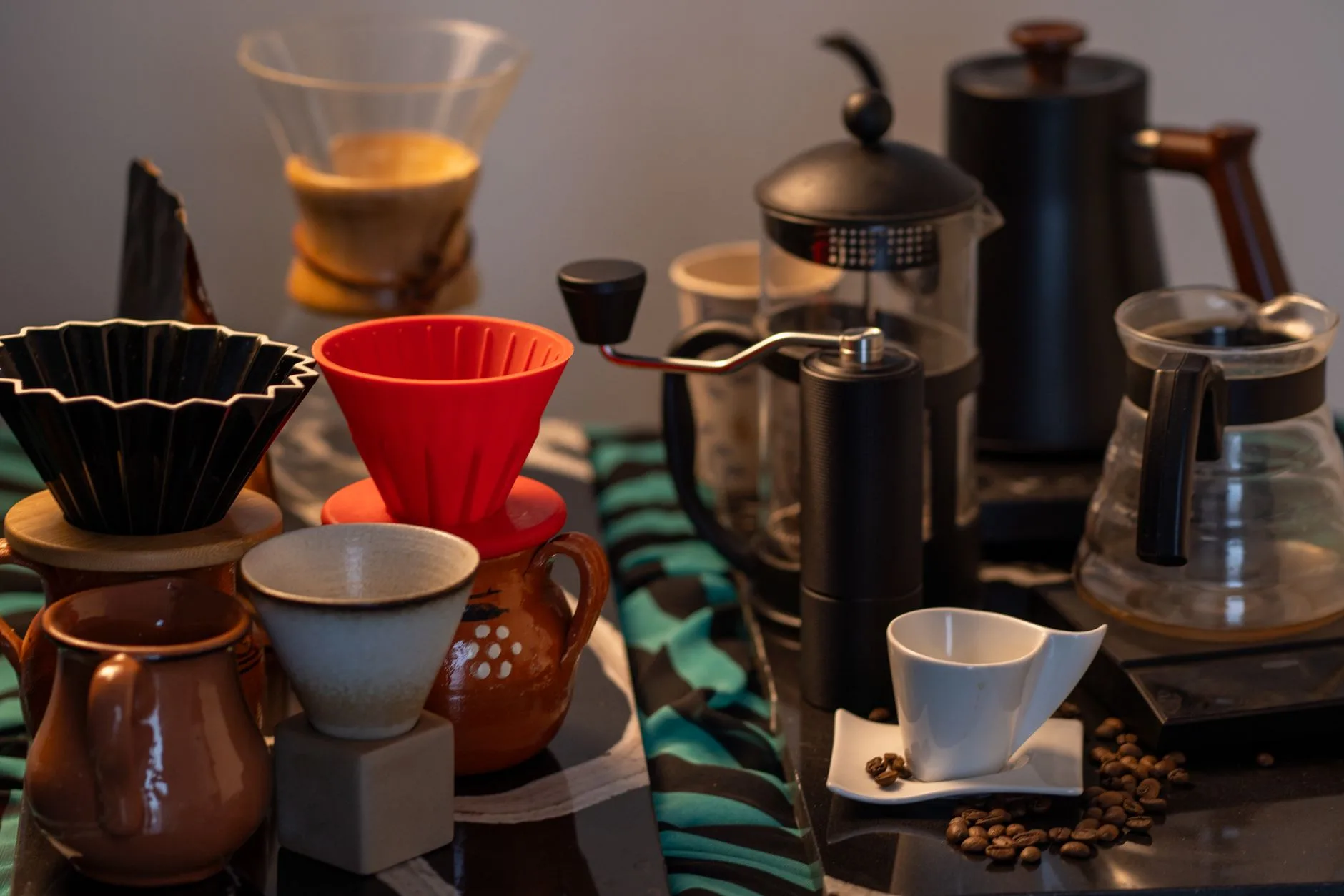 Home espresso grinder setup with portafilter and coffee beans