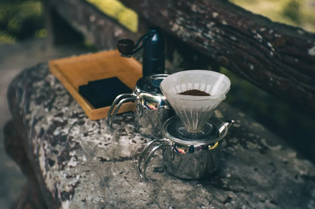 Manual coffee grinder packed with beans for holiday brewing